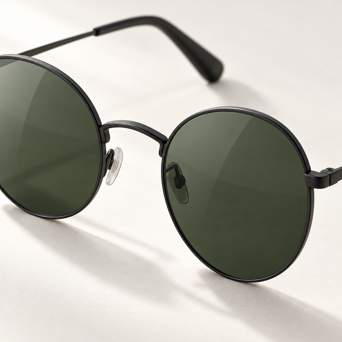 Shadevera Orbit Round sunglasses, matte black metal frame and deep green lenses, detail view