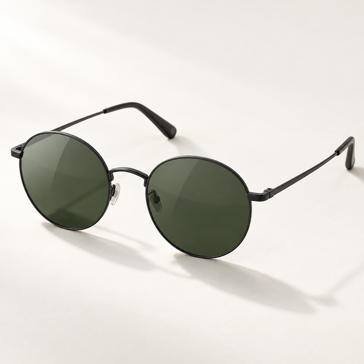 Shadevera Orbit Round sunglasses, matte black metal frame and deep green lenses, hero view
