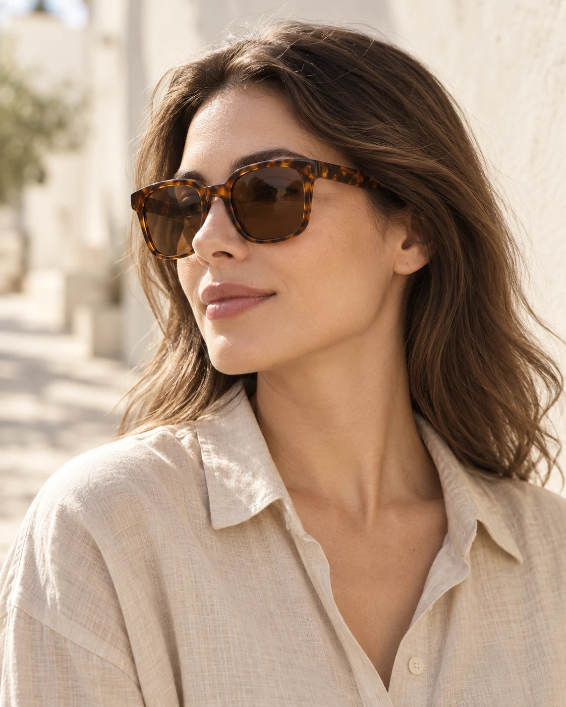 An adult wearing Shadevera Drift Square tortoise sunglasses